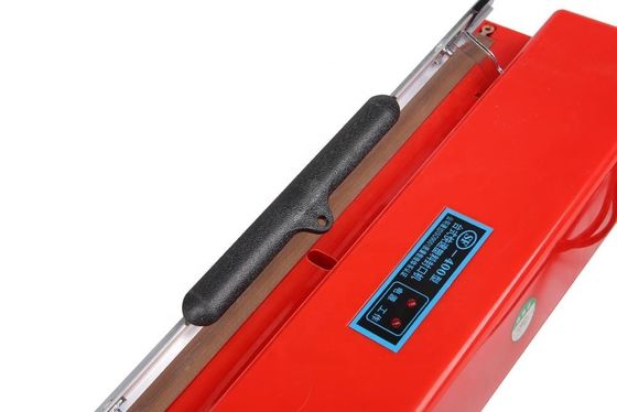 Máquina de embalaje con sellador manual de película de plástico de color rojo SF-400 para el hogar